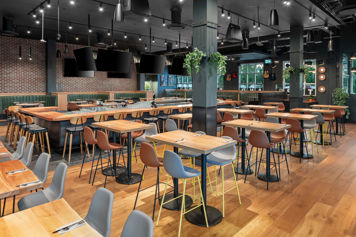 Bar area with central counter and pendant lighting